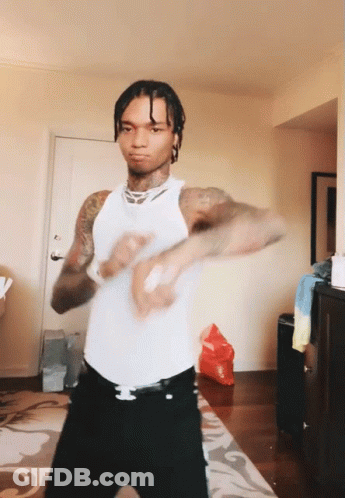 Man In White Tank Top Dancing In Living Room GIF