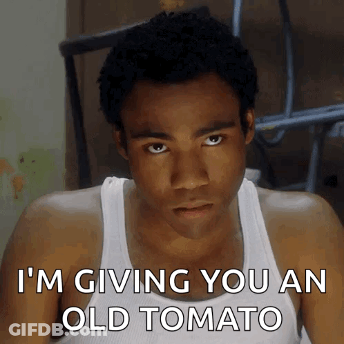 Man In White Tank Top Giving Old Tomato GIF