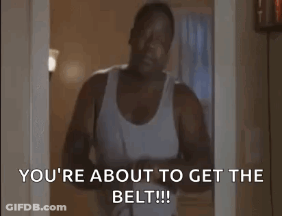 Man In White Tank Top Holding Belt GIF