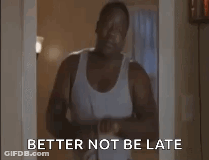 Man In White Tank Top Holding Hair Dryer And Dumbbell GIF
