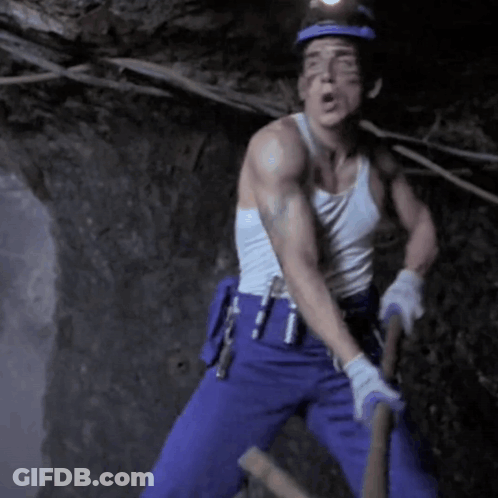 Man In White Tank Top Holding Hammer GIF
