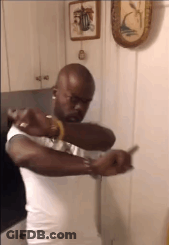Man In White Tank Top Holding Knife GIF