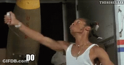 Man In White Tank Top Holding Remote Saying Do GIF
