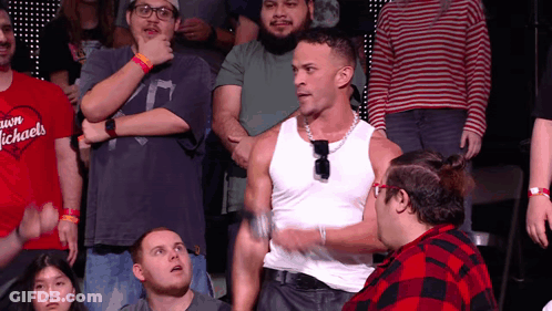 Man In White Tank Top In Front Of Crowd GIF