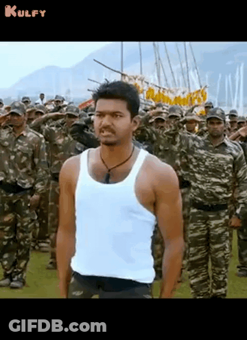 Man In White Tank Top In Front Of Soldiers GIF