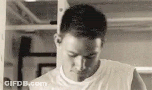 Man In White Tank Top In Gym Mirror GIF