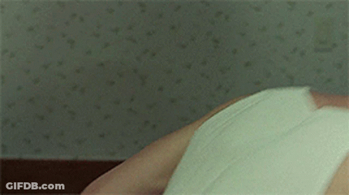 Man In White Tank Top Lying Down GIF
