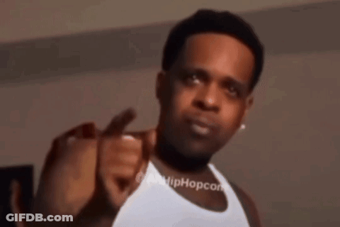 Man In White Tank Top Pointing At Camera GIF