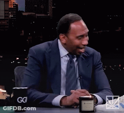 Man In White Tank Top Sitting On Couch GIF