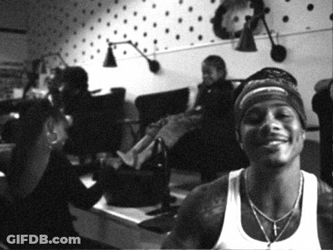 Man In White Tank Top Smiling In Room GIF