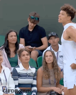 Man In White Tank Top Standing In Stadium GIF