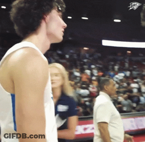 Man In White Tank Top Thunder Logo Crowd GIF