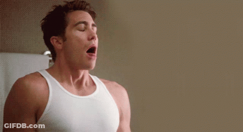 Man In White Tank Top With Eyes Closed GIF
