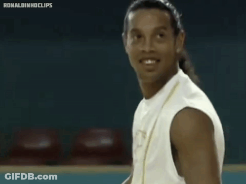 Man In White Tank Top With Letter P Smiling GIF