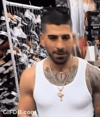 Man In White Tank Top With T Tattoo On Neck GIF