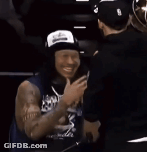 Man In White Tank Top With Thunder Logo Facing Crowd GIF