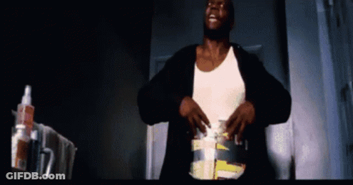 Man In White Tank Top With Toothpaste Bottle In Dark Room GIF