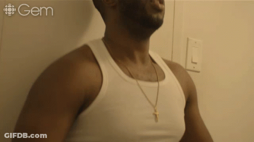 Man In White Tank Top With Word Gem GIF