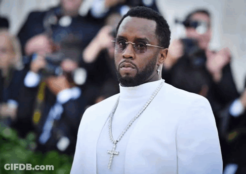 Man In White Turtleneck And Cross Necklace GIF