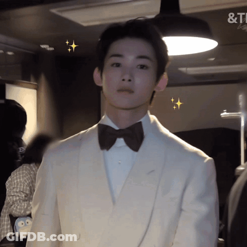 Man In White Tuxedo And Bow Tie &T Sign GIF