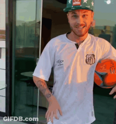 Man In White Umbro Shirt Holding Orange Soccer Ball GIF