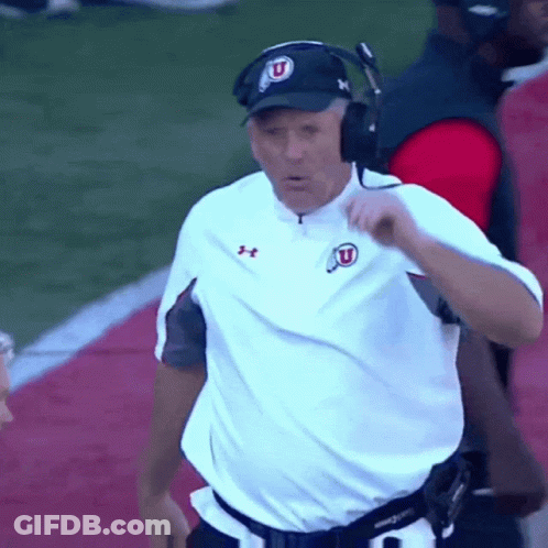 Man In White Under Armour Shirt And Hat With Letter U GIF