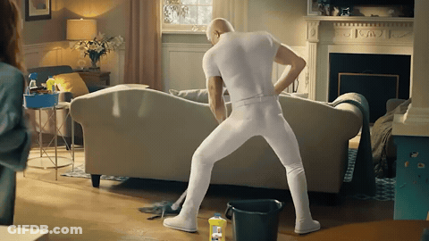 Man In White Underwear Standing By Couch GIF