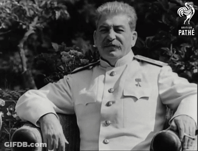 Man In White Uniform Sitting In Chair GIF