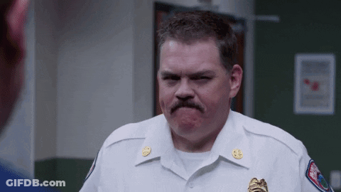 Man In White Uniform With Mustache Making Funny Face GIF