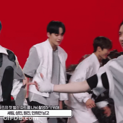Man In White Vest Holding Arm GIF