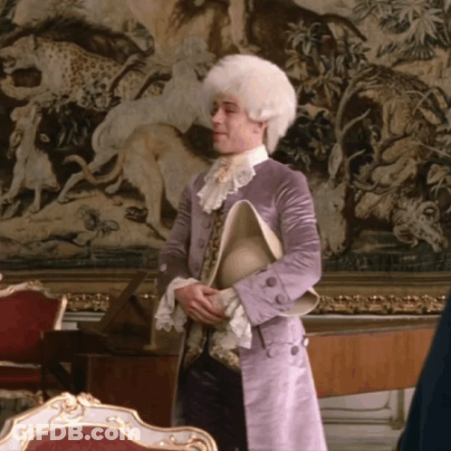 Man In White Wig And Purple Coat Holding Hat GIF