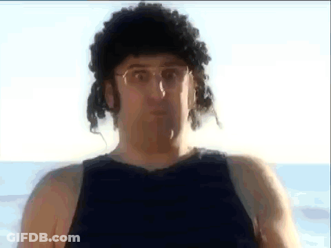 Man In Wig And Glasses On Beach GIF