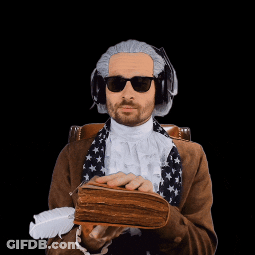 Man In Wig And Sunglasses Holding Book And Feather GIF