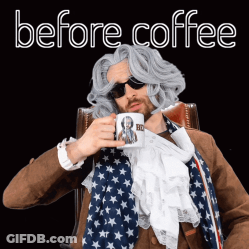Man In Wig And Sunglasses Holding Coffee Mug Saying Be GIF