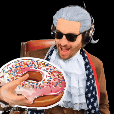 Man In Wig And Sunglasses Holding Donut With Sprinkles GIF