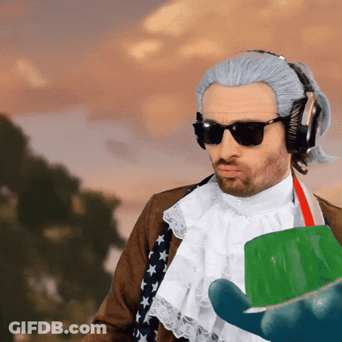 Man In Wig And Sunglasses Holding Green Container GIF