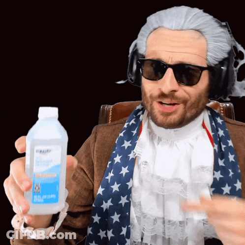 Man In Wig And Sunglasses Holding Hydrogen Peroxide GIF