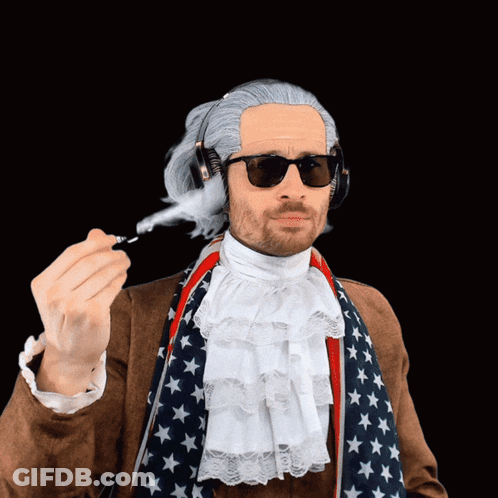 Man In Wig And Sunglasses Holding Pen GIF