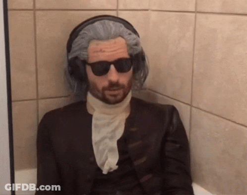 Man In Wig And Sunglasses In Bathroom GIF