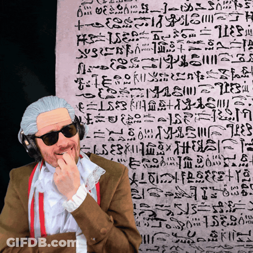 Man In Wig And Sunglasses In Front Of Arabic Writing GIF