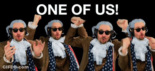Man In Wig And Sunglasses In Front Of One Of Us Sign GIF