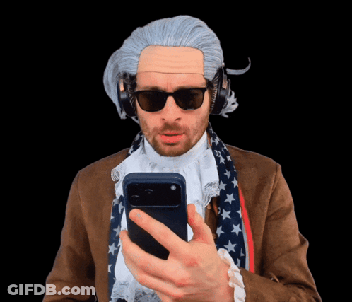 Man In Wig And Sunglasses Looking At Phone GIF