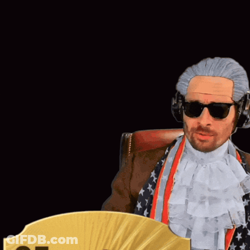 Man In Wig And Sunglasses Next To Card 85 Cdm GIF