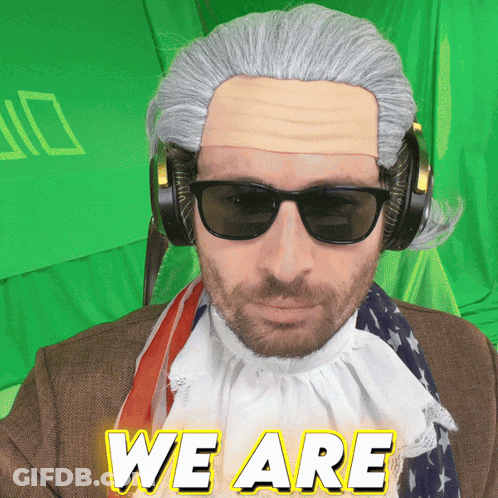 Man In Wig And Sunglasses Saying We Are In GIF