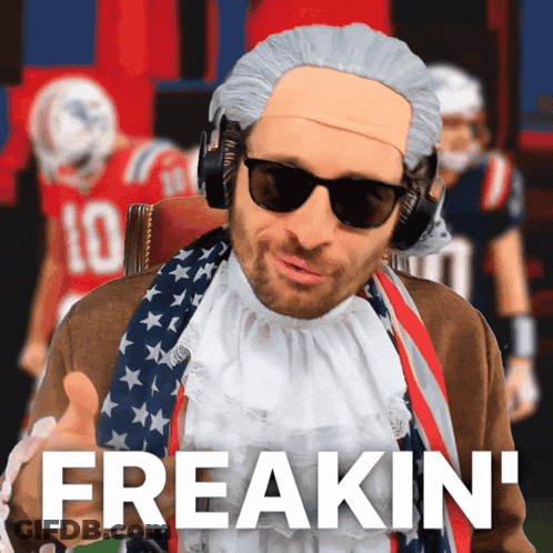 Man In Wig And Sunglasses Says Freakin In Front Of Football Players GIF