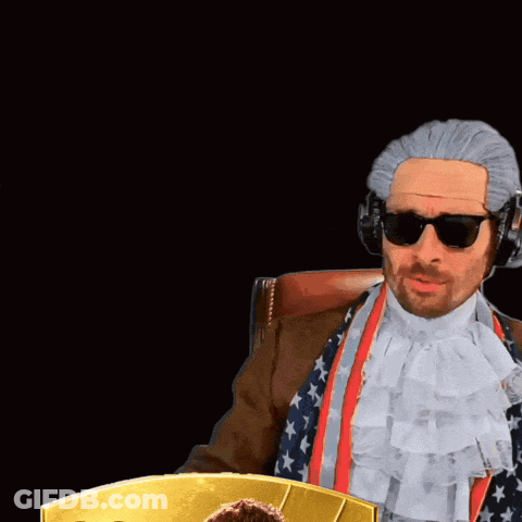 Man In Wig And Sunglasses With Card Number 99 GIF