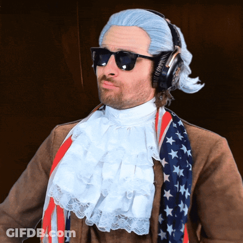 Man In Wig And Sunglasses With Headphones And American Flag Scarf GIF