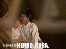 Man In Wig And White Shirt Says Herro Bara GIF