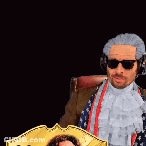 Man In Wig Holding 99 Card GIF