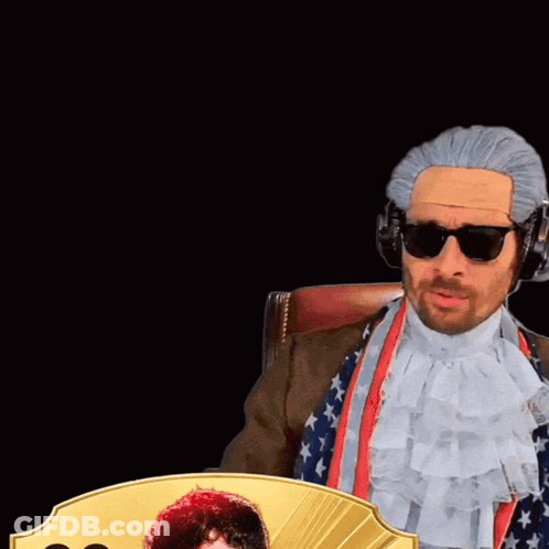 Man In Wig Holding Card 99 GIF